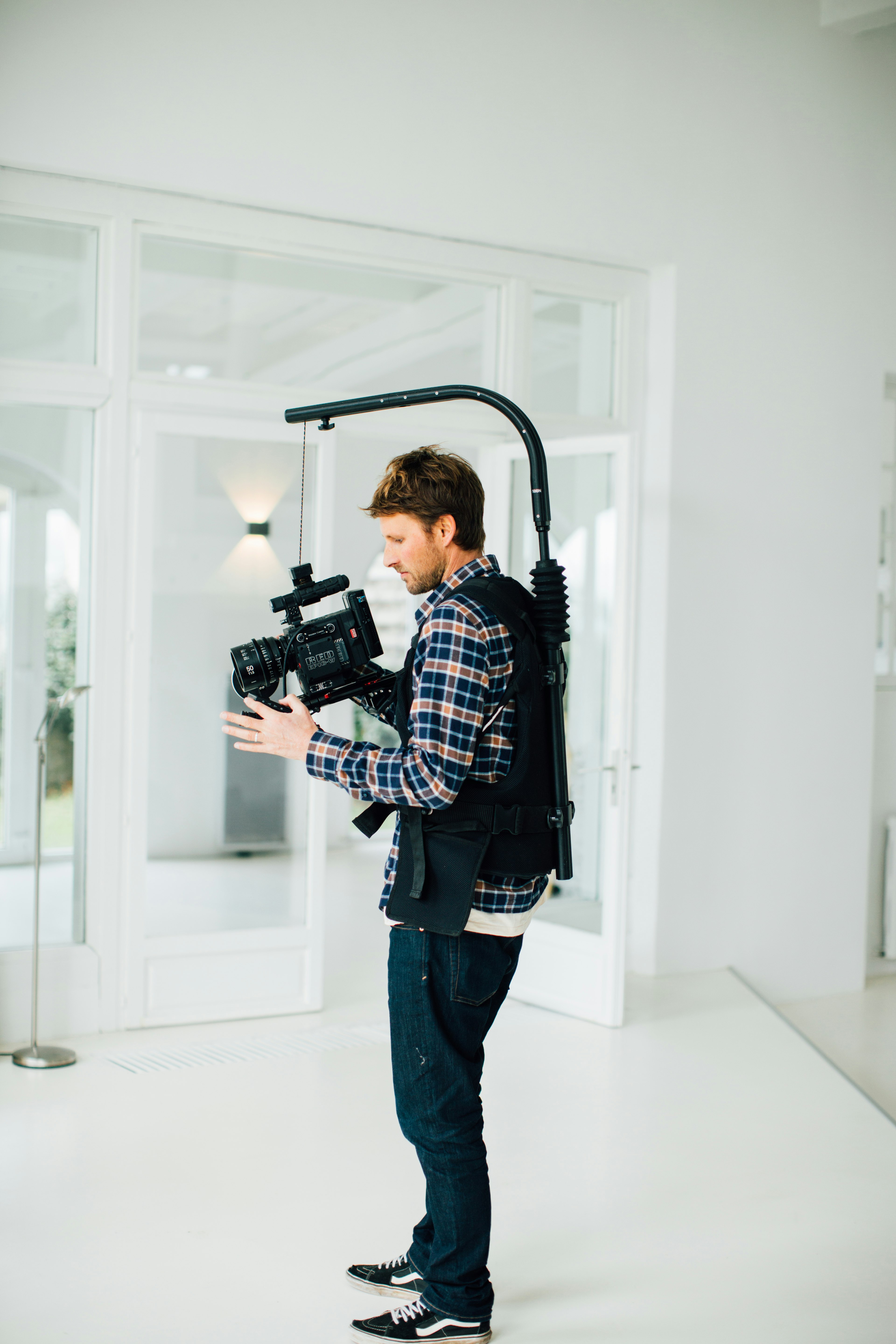 man using black video camera